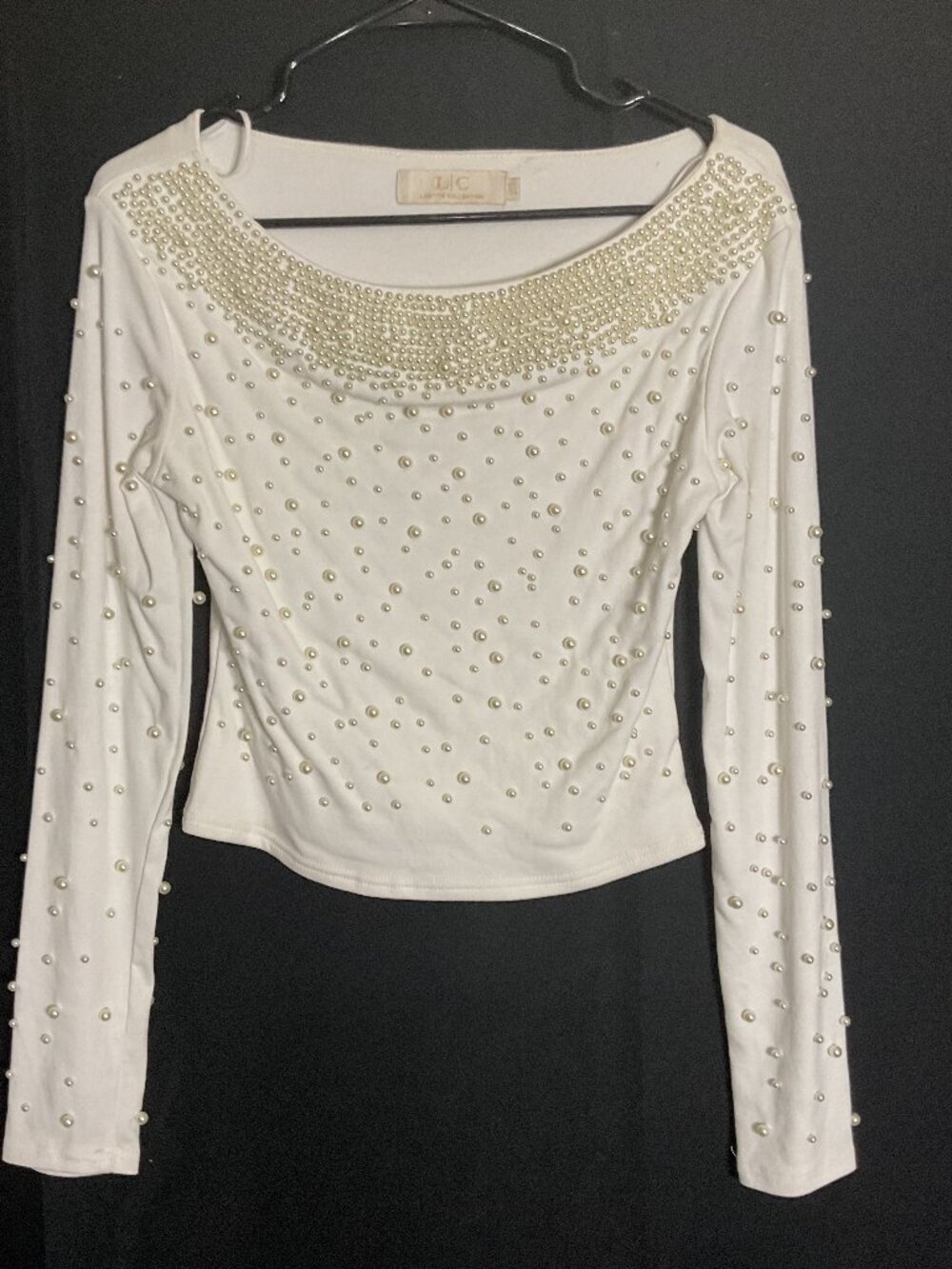 Off white/cream fitted pearl long sleeves shirt.